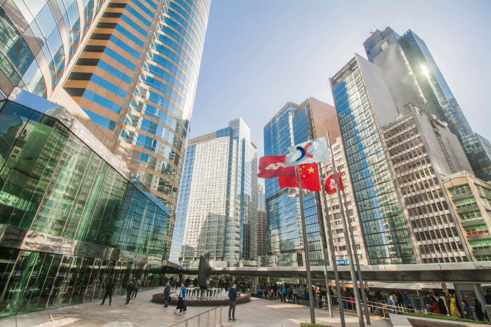 Asian market: The Forumof Exchange Square with skyscrapers in the background.