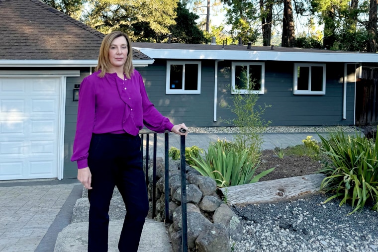 Rana Robillard, an Oakland-based tech executive, in front of the home in Orinda, Calif., that she attempted to purchase earlier this year.